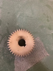 Worn plastic gear. We 3d printed a replacement.