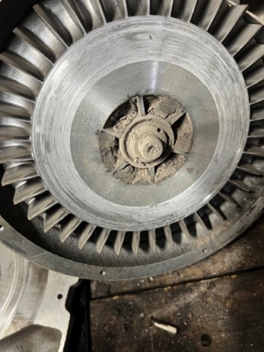 The fan was completely clogged with dust, causing the aluminium to catch and jam.
